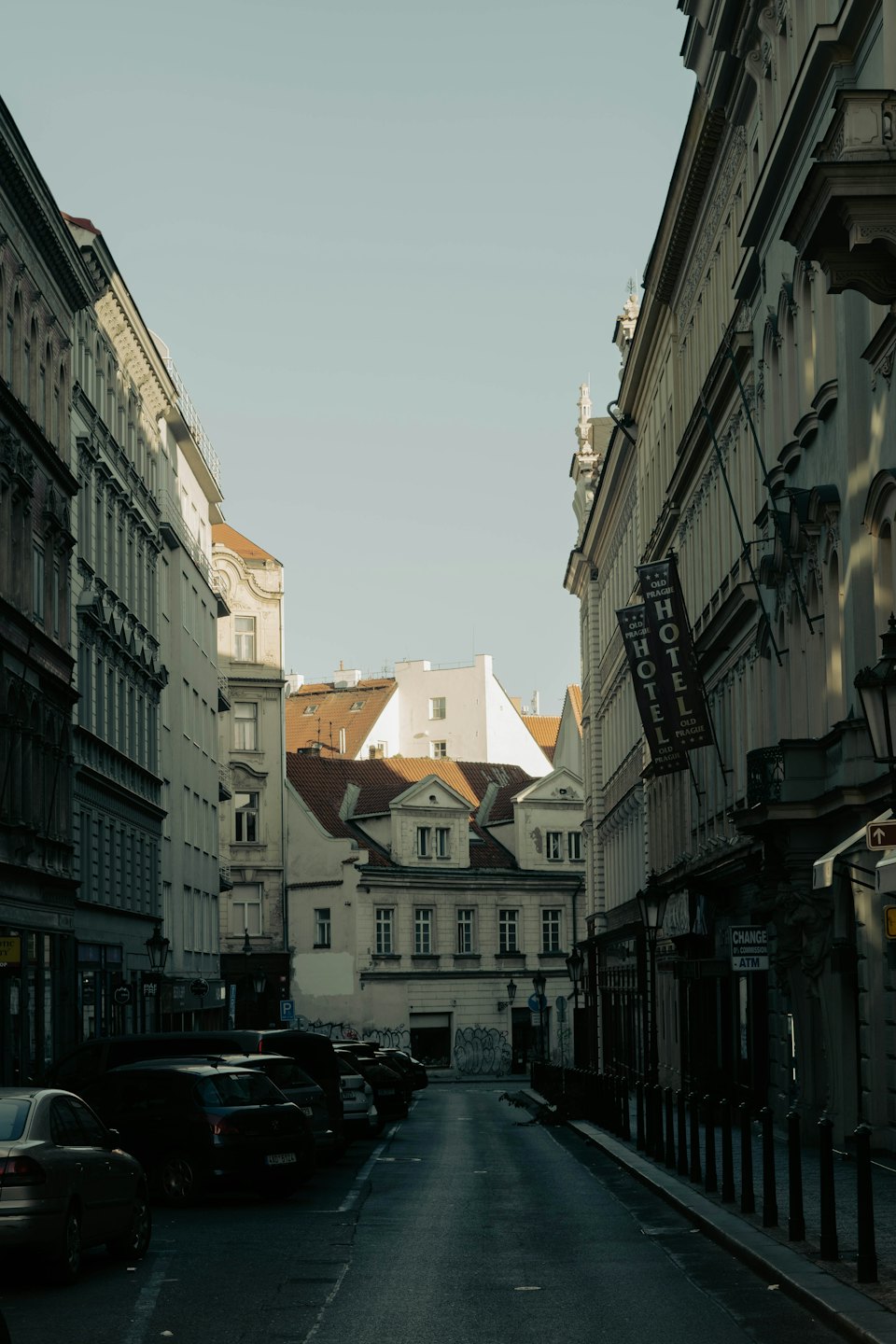 Cars parked along a historic street in Old Prague.